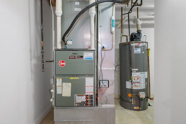 utility room with heating unit and gas water heater