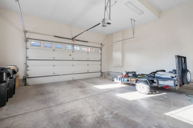 garage featuring a garage door opener