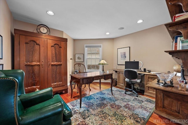 office space with recessed lighting and light wood-style floors