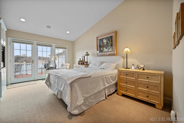 bedroom with access to exterior, lofted ceiling, light carpet, and recessed lighting