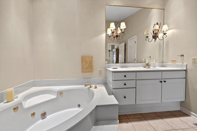 bathroom featuring a chandelier, a jetted tub, tile patterned flooring, and vanity