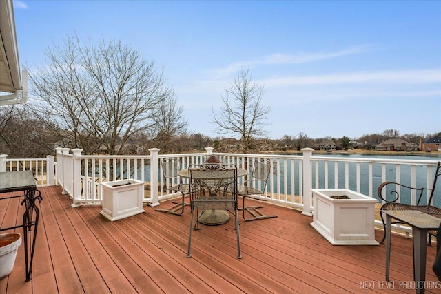 wooden deck with a water view