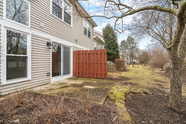 view of yard featuring fence and a patio