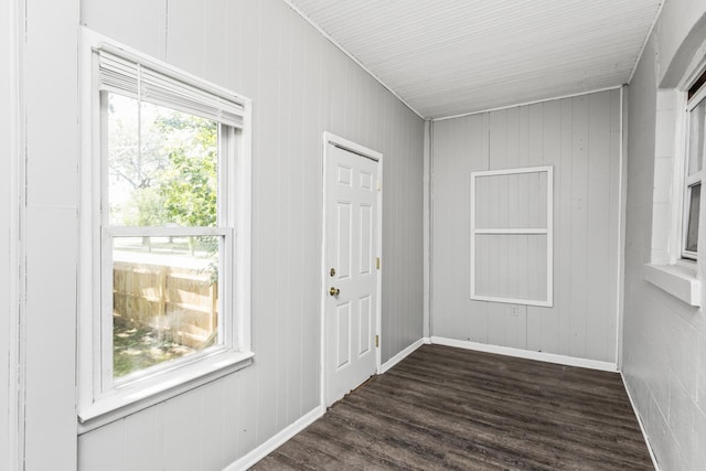 interior space with dark wood finished floors and baseboards