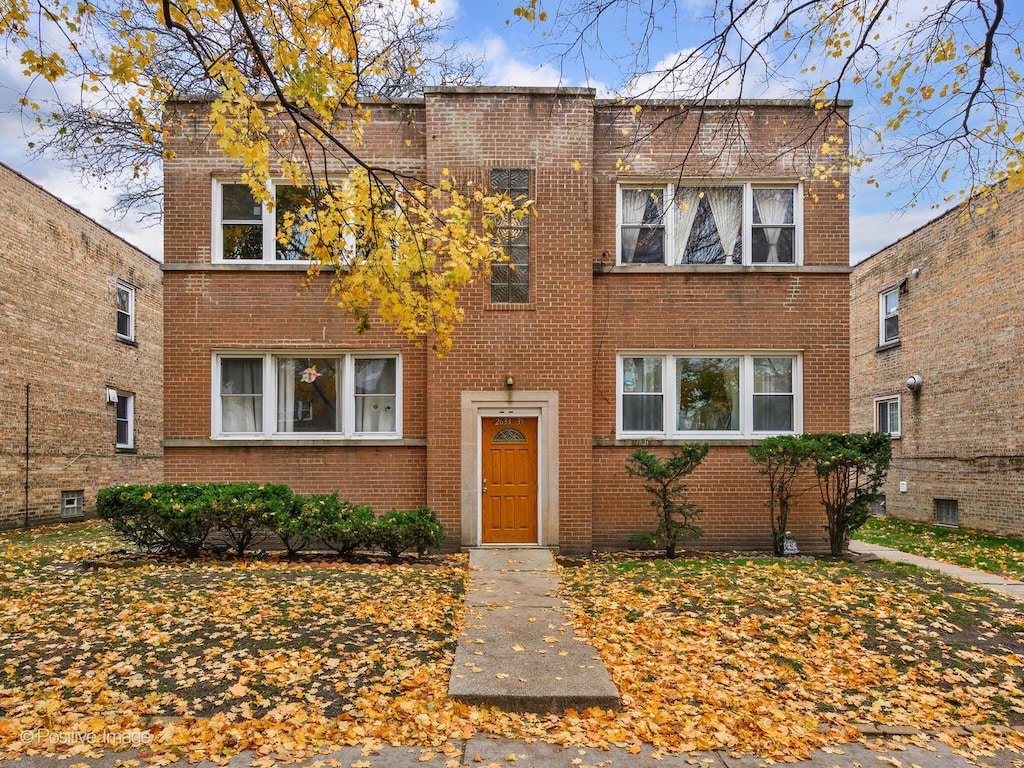 view of front of home with brick siding