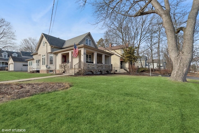 view of side of property with a porch and a yard