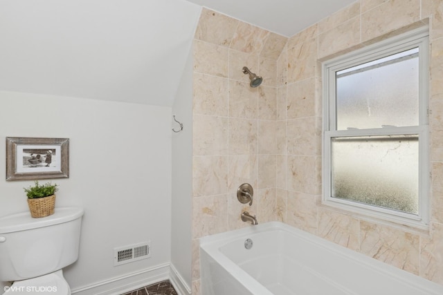 bathroom with toilet, baseboards, visible vents, and shower / bathtub combination