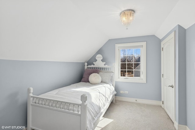 bedroom featuring carpet flooring, vaulted ceiling, and baseboards