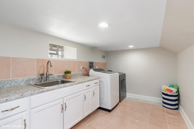 washroom with light tile patterned floors, hookup for a washing machine, recessed lighting, a sink, and visible vents