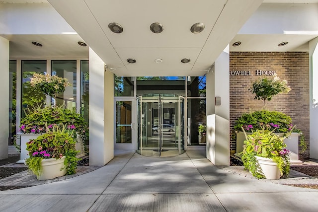 property entrance featuring brick siding