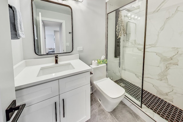 full bathroom with toilet, a marble finish shower, and vanity