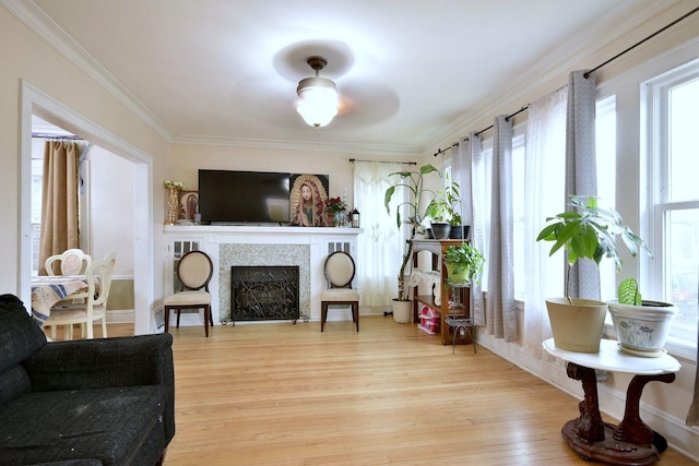 sunroom featuring a tiled fireplace