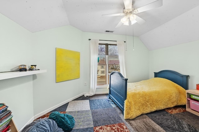 bedroom with a ceiling fan, lofted ceiling, and baseboards