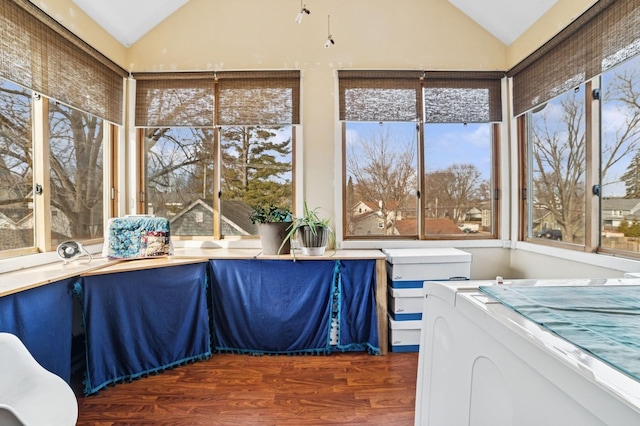 sunroom / solarium featuring lofted ceiling