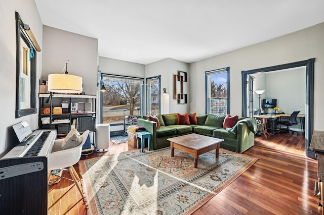 living room with hardwood / wood-style flooring and baseboard heating