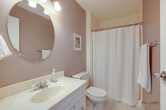 bathroom featuring tile patterned flooring, a shower with curtain, vanity, and toilet