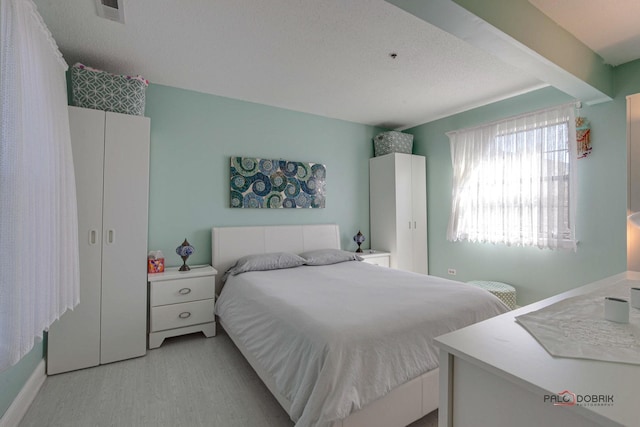 bedroom featuring visible vents