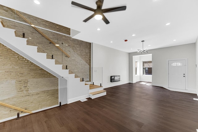 interior space featuring stairs, recessed lighting, visible vents, wood finished floors, and ceiling fan with notable chandelier