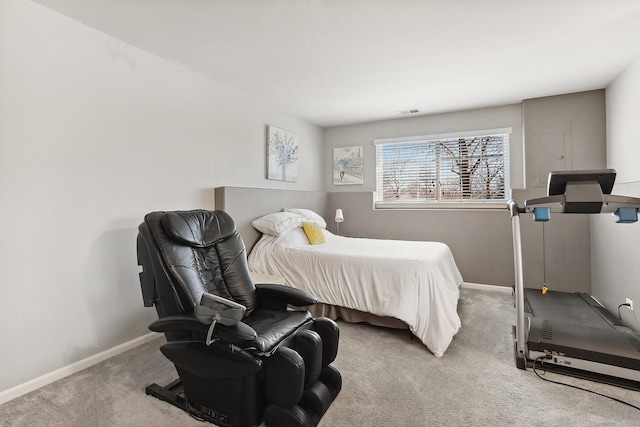 carpeted bedroom featuring visible vents and baseboards