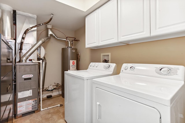 laundry room with cabinet space, light tile patterned floors, electric water heater, heating unit, and separate washer and dryer