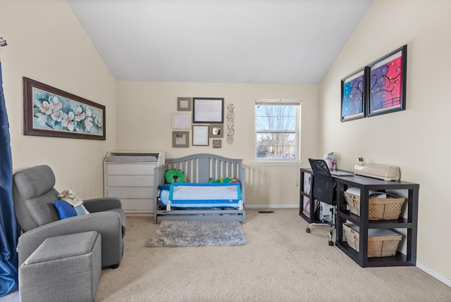 carpeted bedroom with vaulted ceiling and baseboards