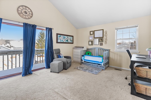 carpeted home office featuring plenty of natural light, baseboards, visible vents, and high vaulted ceiling