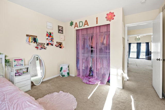 carpeted bedroom featuring visible vents and baseboards