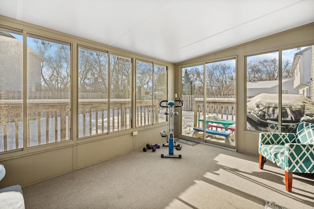 unfurnished sunroom featuring lofted ceiling