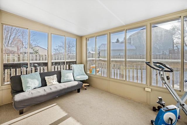 sunroom featuring a wealth of natural light and vaulted ceiling