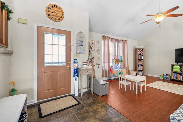 entrance foyer with baseboards, a ceiling fan, and lofted ceiling