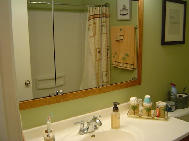 bathroom with vanity and a shower with shower curtain