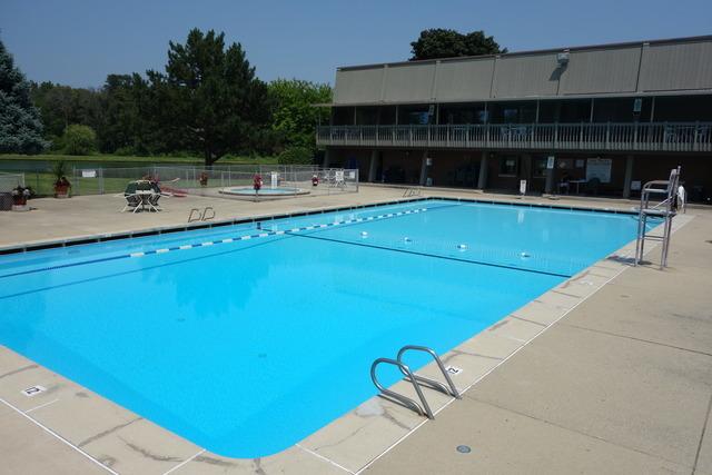 pool featuring a patio and fence