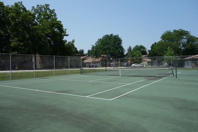 view of sport court with fence