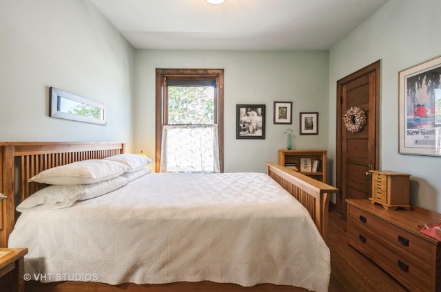 bedroom with wood finished floors