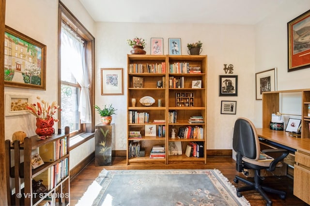 office with baseboards, a wealth of natural light, and wood finished floors