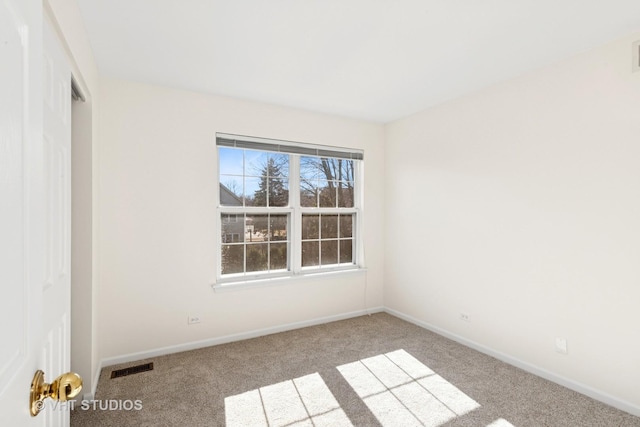 unfurnished bedroom featuring carpet floors, a closet, visible vents, and baseboards