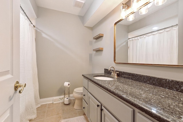 bathroom featuring visible vents, baseboards, toilet, tile patterned flooring, and vanity