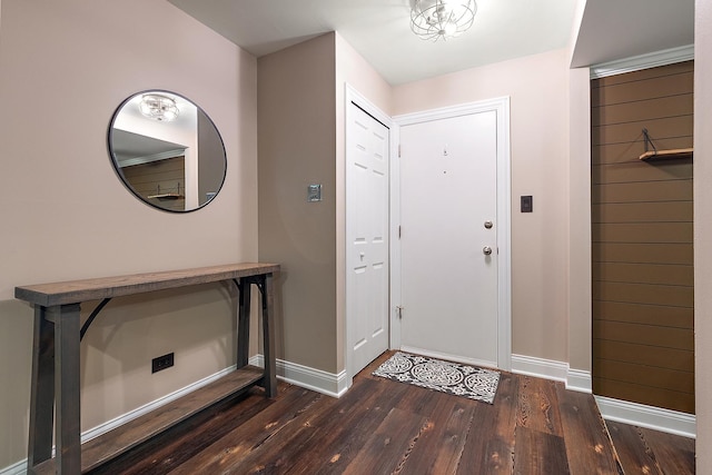 entrance foyer featuring baseboards and hardwood / wood-style floors