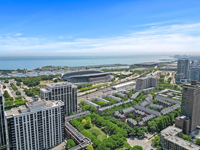 bird's eye view featuring a water view and a city view