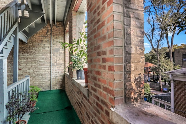 view of side of property with brick siding