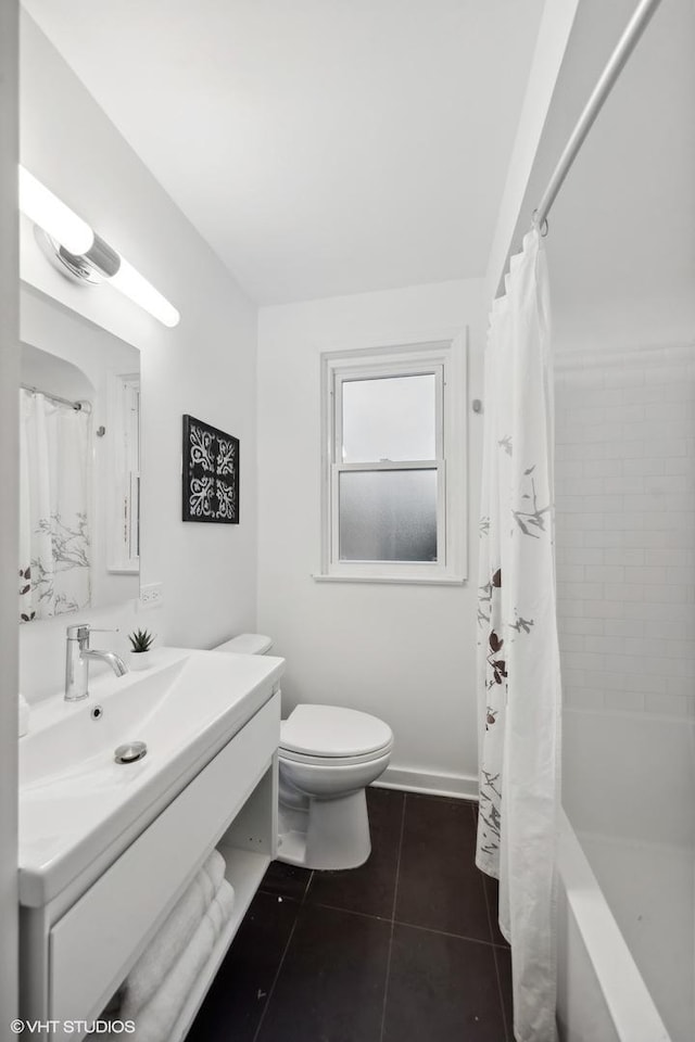 full bathroom with tile patterned flooring, toilet, vanity, baseboards, and shower / bath combination with curtain