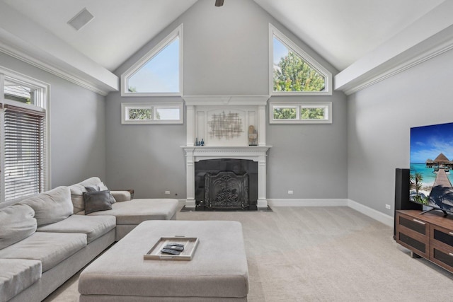 living area with light carpet, baseboards, a fireplace with flush hearth, and a healthy amount of sunlight