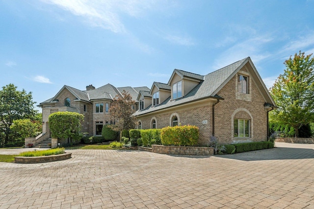 view of front of property featuring brick siding