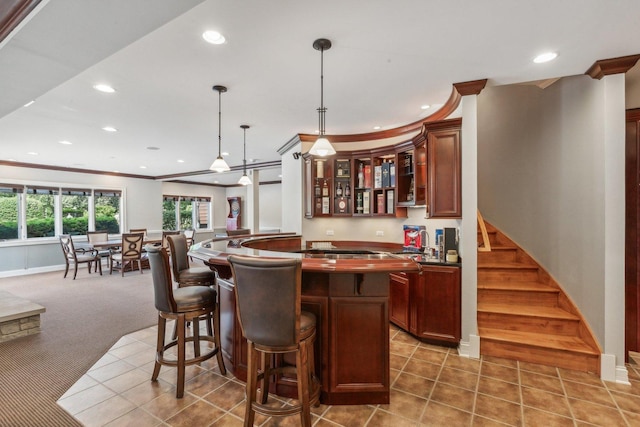 bar with recessed lighting, carpet flooring, crown molding, and tile patterned floors