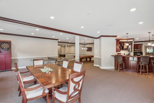 dining area with carpet floors, recessed lighting, ornamental molding, and baseboards