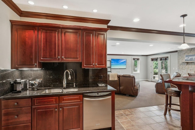 kitchen featuring open floor plan, tasteful backsplash, a sink, and reddish brown cabinets