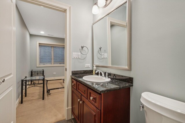 half bath with toilet and vanity