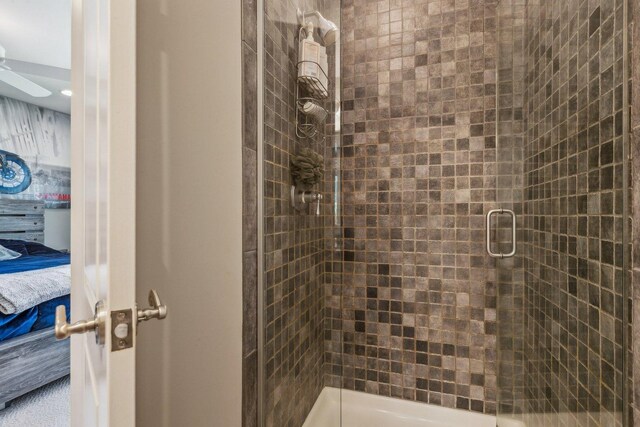 full bathroom featuring ensuite bath and a shower stall