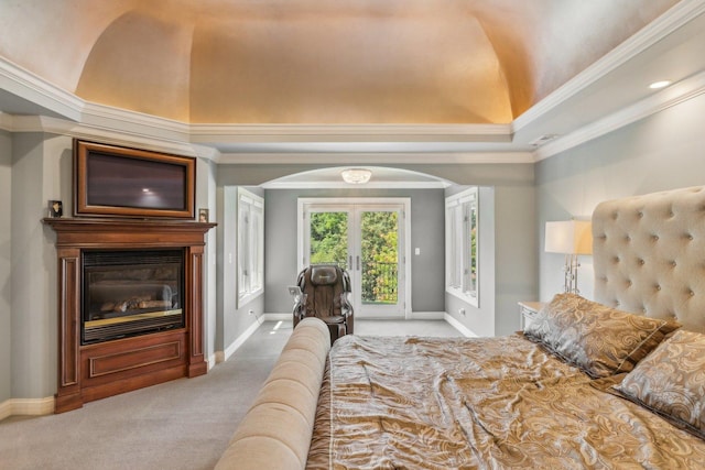 bedroom featuring arched walkways, carpet floors, a fireplace, access to exterior, and crown molding