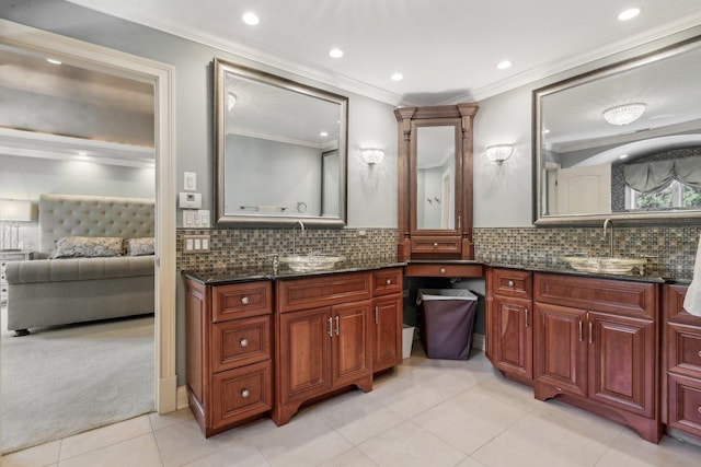 ensuite bathroom with ensuite bathroom, ornamental molding, backsplash, and vanity